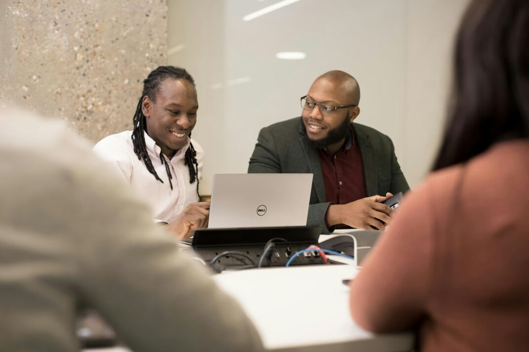diverse group discussing technology